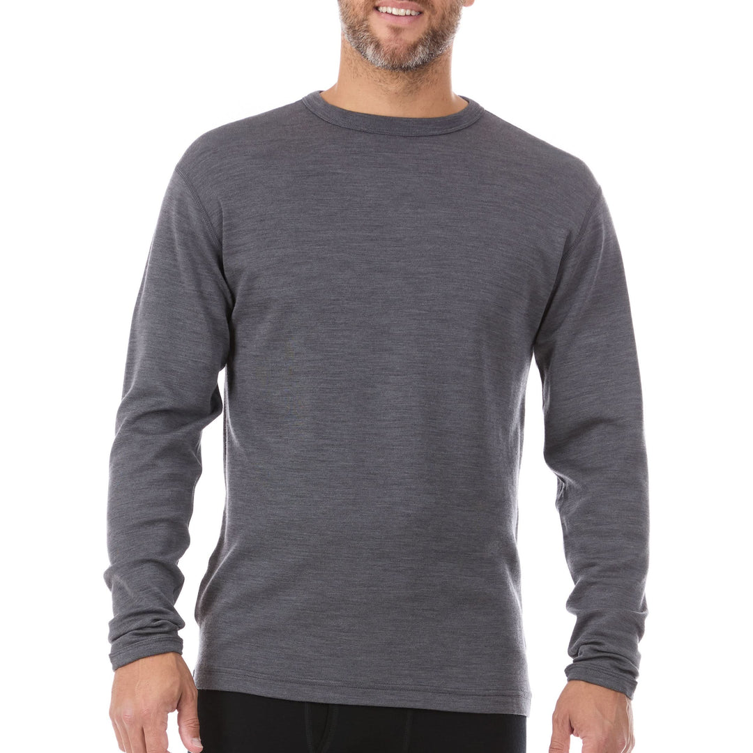 A man models a super soft, long sleeved merino wool thermal base layer crew. This top makes for a perfect first layer on a winter hike, or a nice casual wear on the chilly days of autumn and spring, front view 