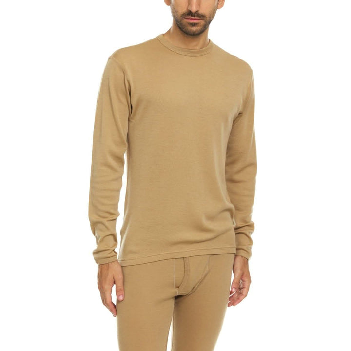 A man models a super soft, long sleeved merino wool thermal base layer crew. This top makes for a perfect first layer on a winter hike, or a nice casual wear on the chilly days of autumn and spring. 
