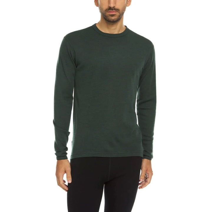 A man models a super soft, long sleeved merino wool thermal base layer crew. This top makes for a perfect first layer on a winter hike, or a nice casual wear on the chilly days of autumn and spring, front view 