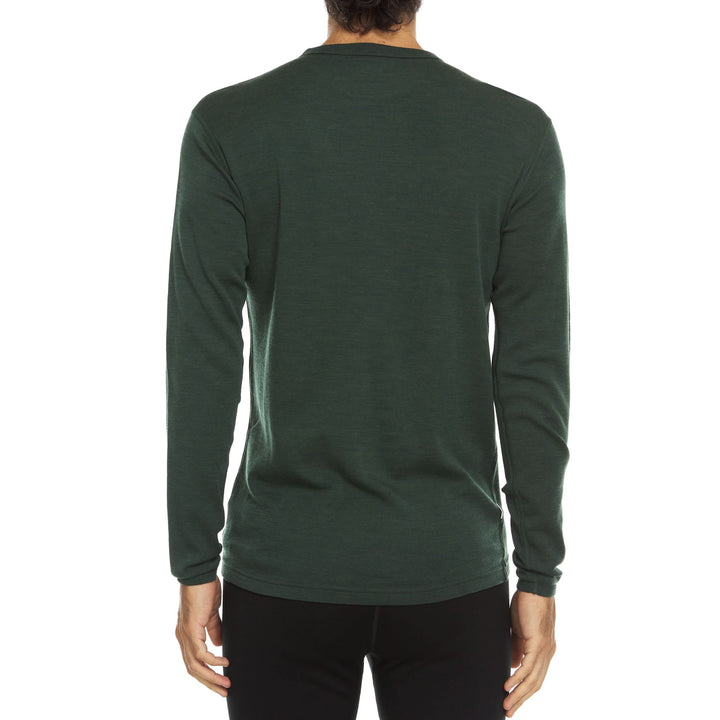 A man models a super soft, long sleeved merino wool thermal base layer crew. This top makes for a perfect first layer on a winter hike, or a nice casual wear on the chilly days of autumn and spring. 