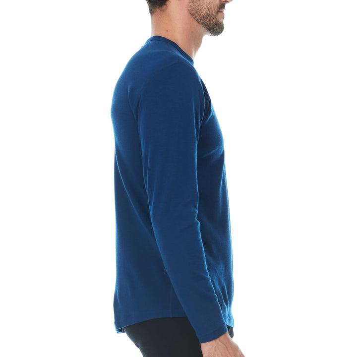 Side view of a navy midweight merino wool base-layer crew top