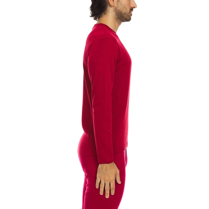 A man models a super soft, long sleeved merino wool thermal base layer crew. This top makes for a perfect first layer on a winter hike, or a nice casual wear on the chilly days of autumn and spring, right-facing side view 