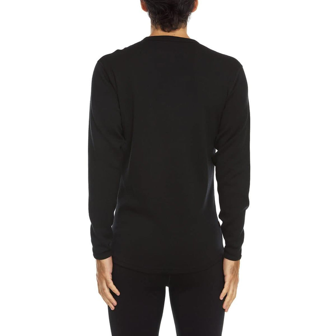 A man models a super soft, long sleeved merino wool thermal base layer crew. Whether you&