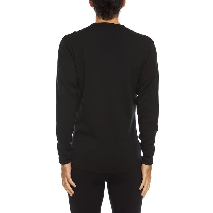 A man models a super soft, long sleeved merino wool thermal base layer crew. Whether you&