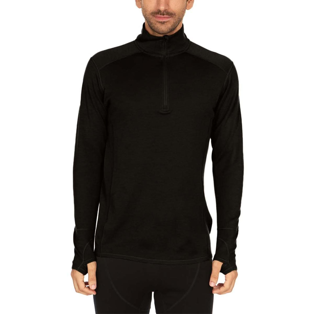 A man models the merino wool midweight quarter zip sweater, tall, complete with flat-lock seams and thumbholes. 