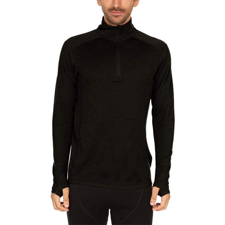 A man models the merino wool midweight quarter zip sweater, tall, complete with flat-lock seams and thumbholes. 