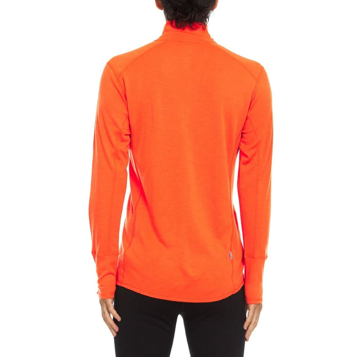 A man models the merino wool midweight quarter zip sweater, complete with flat-lock seams and thumbholes, back view 