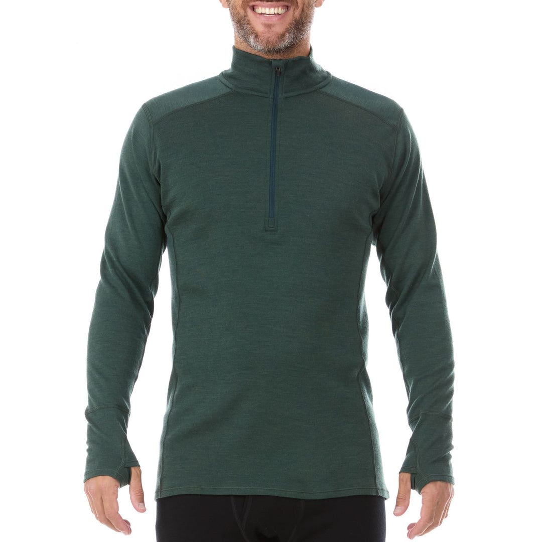A man models the merino wool midweight quarter zip sweater, complete with flat-lock seams and thumbholes. 