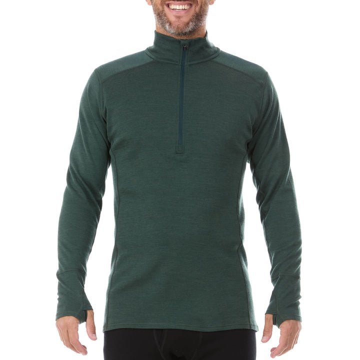A man models the merino wool midweight quarter zip sweater, complete with flat-lock seams and thumbholes. 