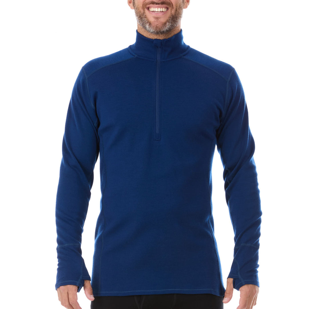 A man models the merino wool midweight quarter zip sweater, complete with flat-lock seams and thumbholes, front view 