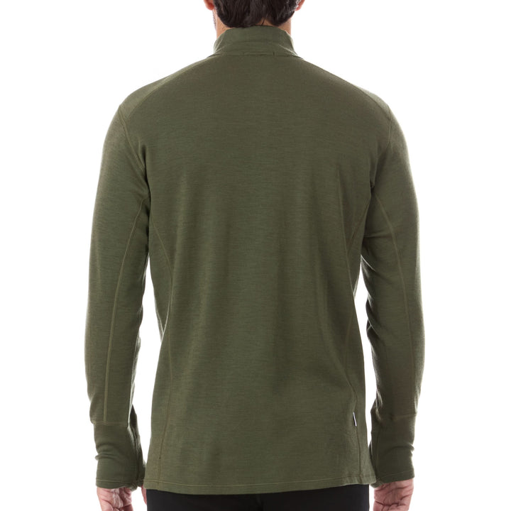 A man models the merino wool midweight quarter zip sweater, complete with flat-lock seams and thumbholes. 