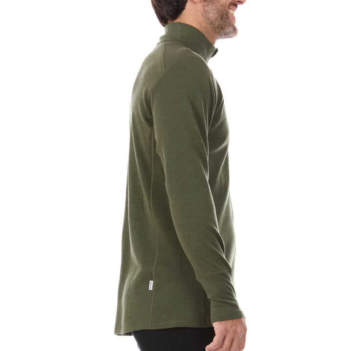 A man models the merino wool midweight quarter zip sweater, complete with flat-lock seams and thumbholes, side view 