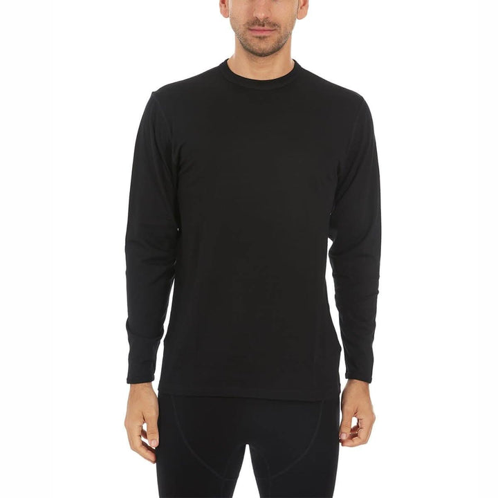 A man models the lightweight long sleeved merino wool base layer crew neck top 