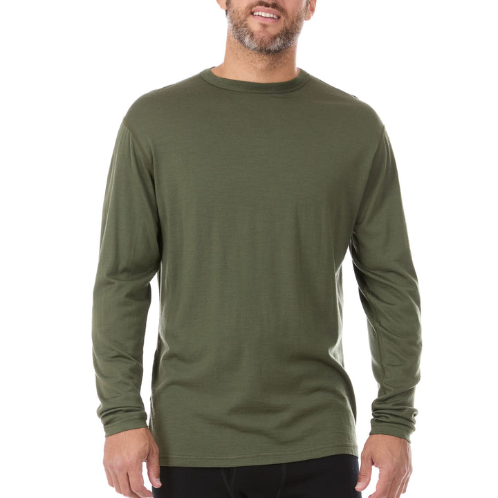 Front view of a man modeling the lightweight long sleeved merino wool base layer crew neck top 