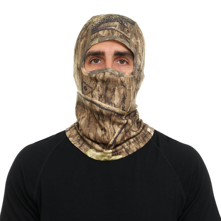 Camouflage merino wool balaclava worn over the face, front view 