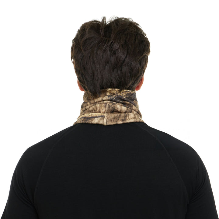 Camouflage merino wool neck gaiter worn lowered around the neck, back view 