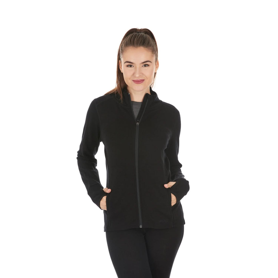 Woman modeling a heavyweight full-zip merino wool sweater, front view with hands in pockets 