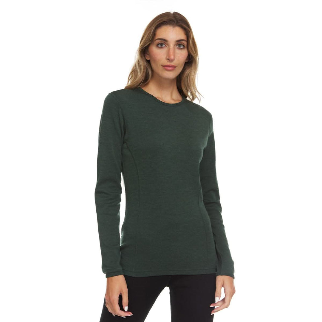 A woman models a soft, 100% merino wool, midweight base layer crew top. The women&