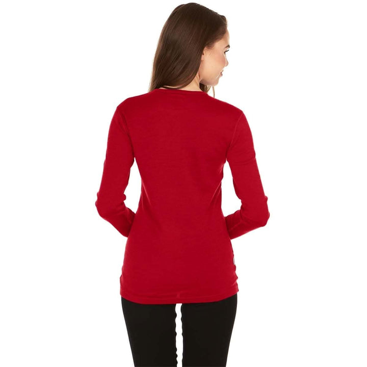 A woman models a soft, 100% merino wool, midweight base layer crew top. The women&