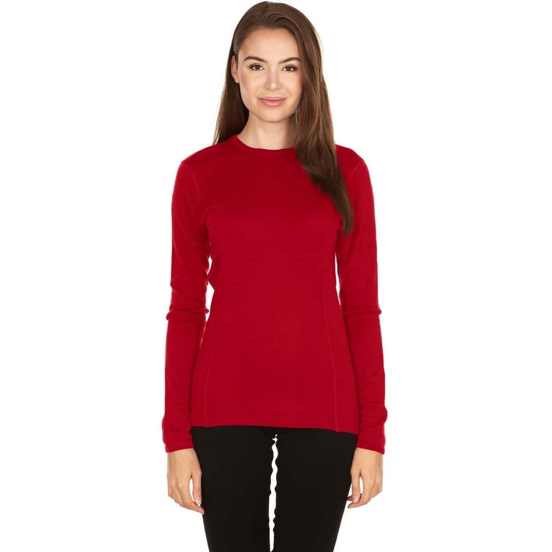 A woman models a soft, 100% merino wool, midweight base layer crew top. The women&