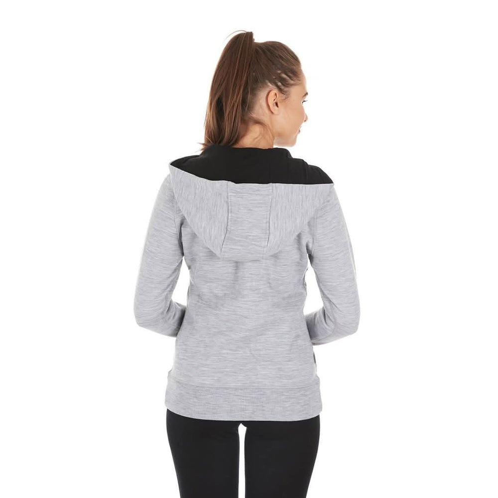 A woman models the heavyweight merino wool brushed fleece hoodie. The hoodie features a large hood with drawstrings, thumbholes, two pockets, and an interior stash pocket inside. Back view. #color_ash-gray
