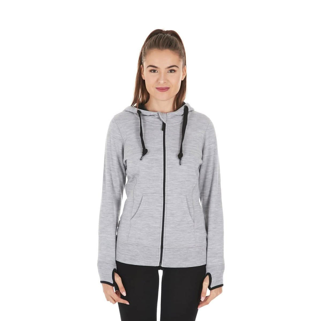 A woman models the heavyweight merino wool brushed fleece hoodie. The hoodie features a large hood with drawstrings, thumbholes, two pockets, and an interior stash pocket inside. Front view 1. #color_ash-gray