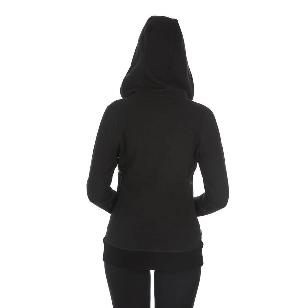 A woman models the heavyweight merino wool brushed fleece hoodie. The hoodie features a large hood with drawstrings, thumbholes, two pockets, and an interior stash pocket inside, back view 