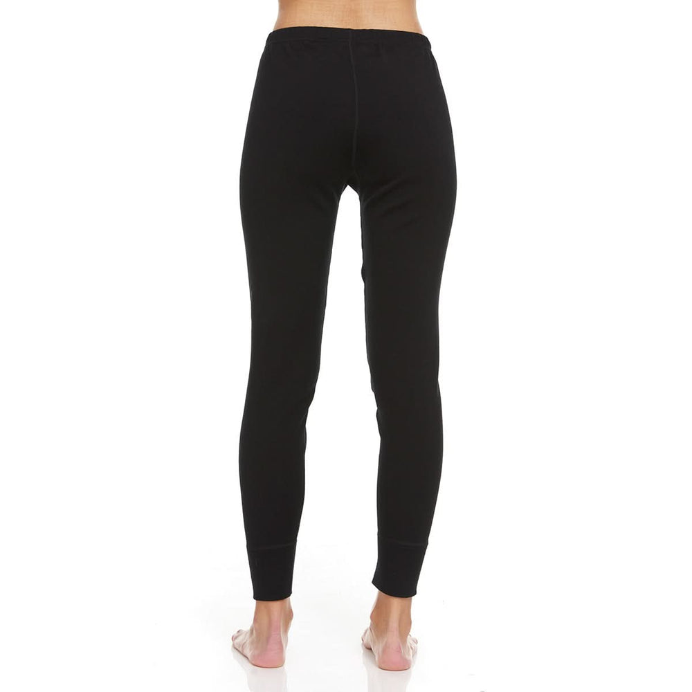 A pair of one hundred percent merino wool heavyweight women's base layer bottoms. These bottoms feature a gusset between the legs for improved range of motion, and cuffs around the ankles for comfort and style. Back view. #color_black
