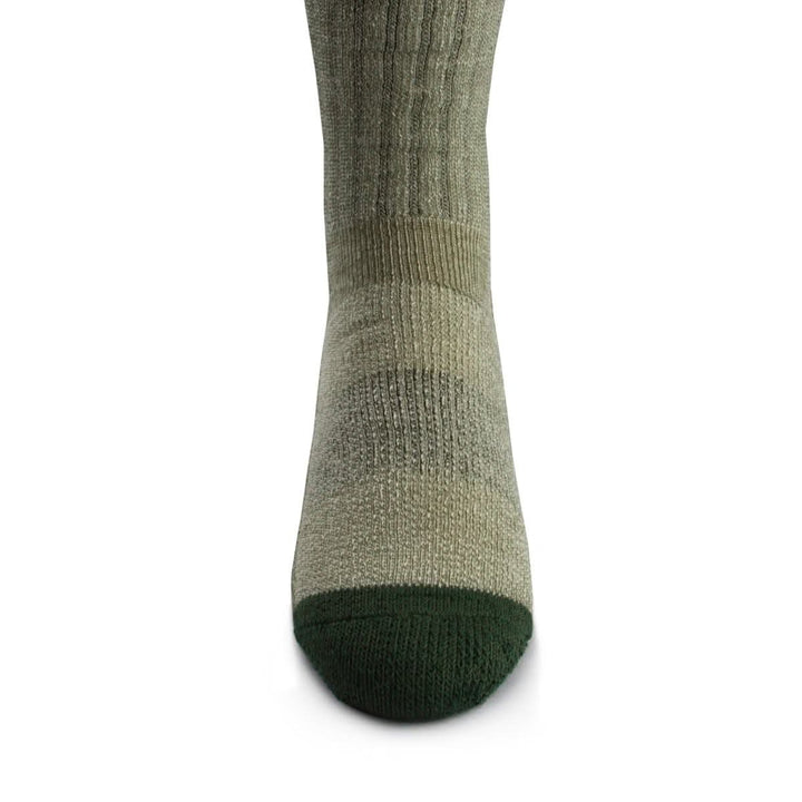 Front close-up view of an olive green merino wool day-hiker sock on a foot form, highlighting the dark forest green reinforced rounded toe, vertical ribbed ventilation panel over the forefoot, and supportive ankle knit 