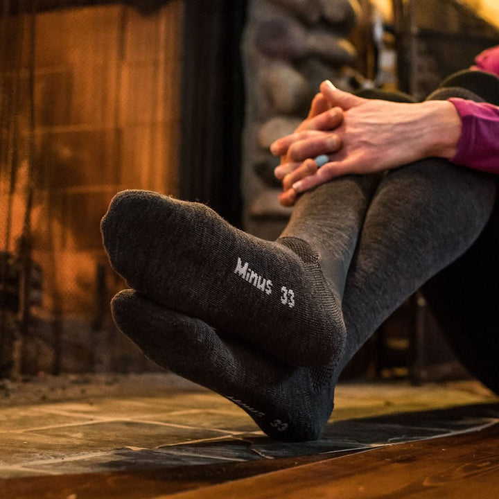 Minus33 Merino Wool Ski and Snowboard Over the Calf Socks - Lightweight, right-facing side view outdoors 