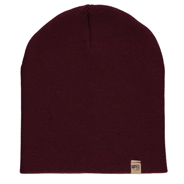A heavyweight, super soft, one hundred percent merino wool beanie. This heavyweight beanie is the warmest hat that we offer, perfect for hiking through the White Mountains, or sitting at a bonfire in January. 