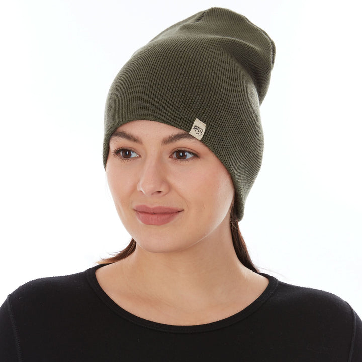 A woman models a heavyweight, super soft, one hundred percent merino wool beanie. This heavyweight beanie is the warmest hat that we offer, perfect for hiking through the White Mountains, or sitting at a bonfire in January, front view 