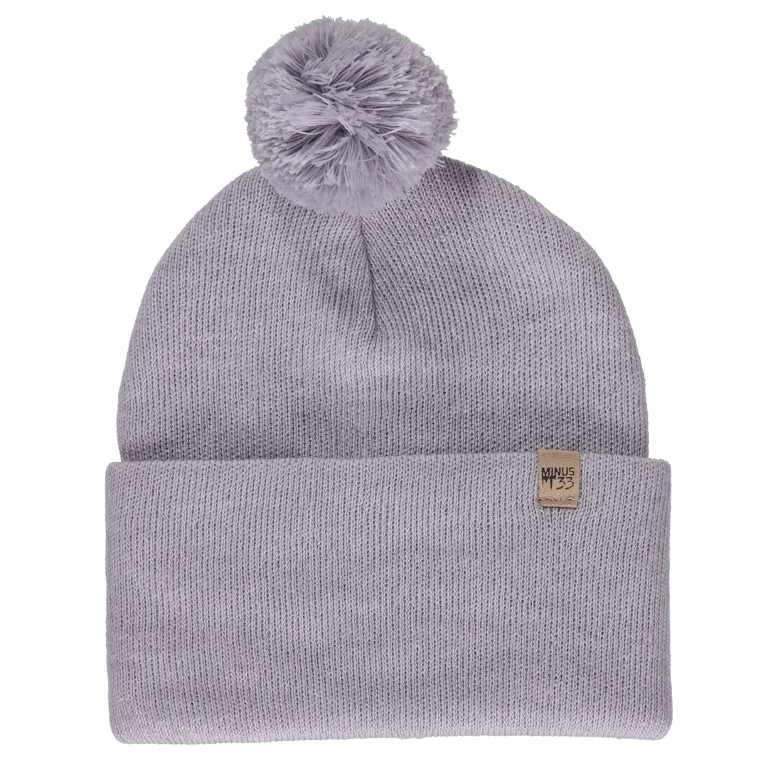 Midweight - Everyday Knit Cuff Pom Beanie 100% Merino Wool.Like our Cuff beanie and made with 100% merino wool, this pom beanie is going to give you the perfect look this winter! Warm and stylish, wear this hat to keep warm whether you’re ice fishing, ice skating, or finishing a long day on the mountain. The activities are endless! This beanie is here to keep you warm during the coldest months, front view #color_ash-gray