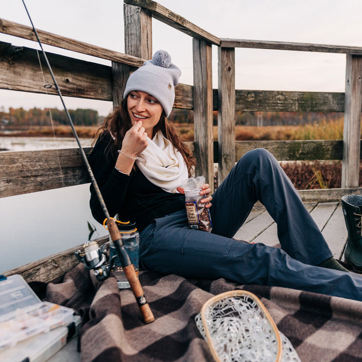 Midweight - Everyday Knit Cuff Pom Beanie 100% Merino Wool.Like our Cuff beanie and made with 100% merino wool, this pom beanie is going to give you the perfect look this winter! Warm and stylish, wear this hat to keep warm whether you’re ice fishing, ice skating, or finishing a long day on the mountain. The activities are endless! This beanie is here to keep you warm during the coldest months.  