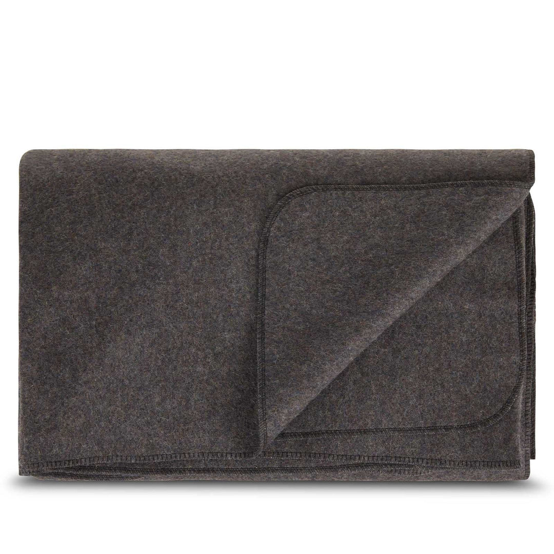 Folded charcoal king wool blanket with one corner turned back 