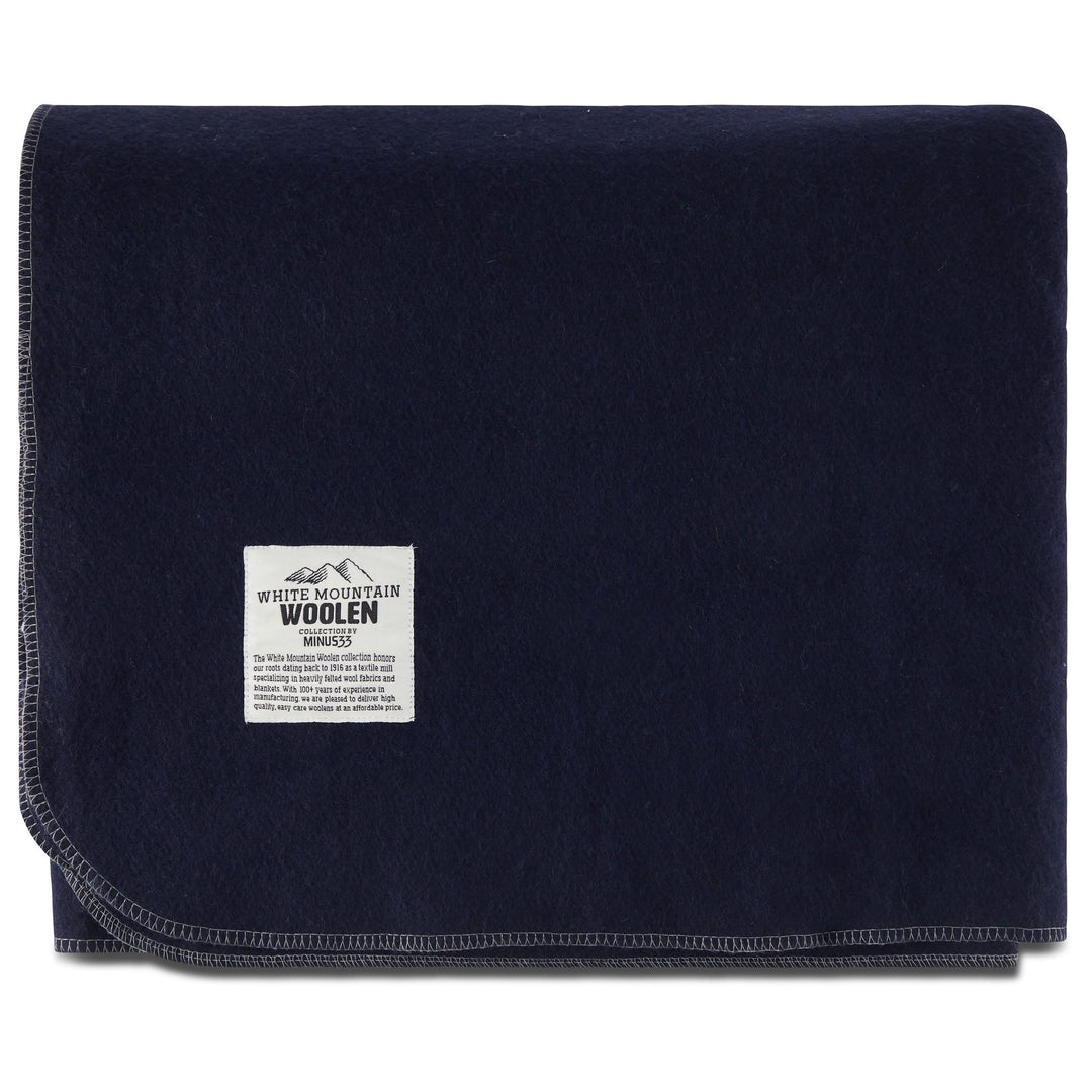Folded navy king wool blanket with White Mountain Woolen label 