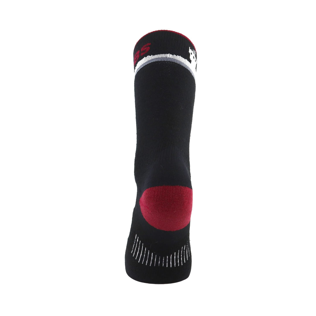 Rear heel view of a black merino wool crew sock with a red reinforced heel, white mountain-pattern cuff, and gray ventilation stitching