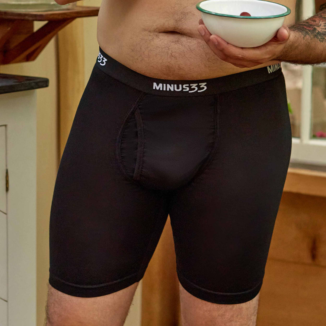 Merino Wool underwear Pouch Boxer Briefs athletic, front lifestyle close-up while holding a bowl 