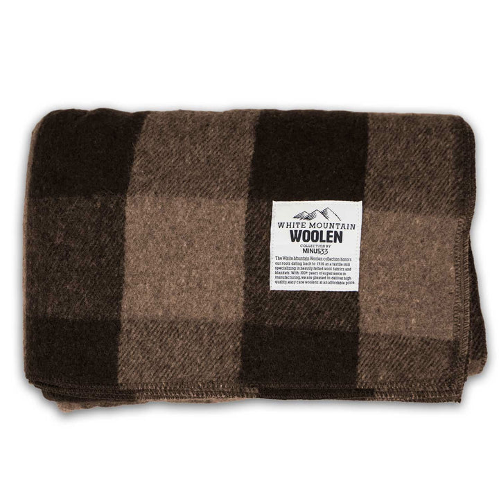 Brown-and-tan plaid lodge wool blanket, folded label view 