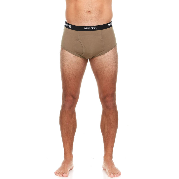 Back view from waist to upper thighs of a man wearing tan Woolverino micro weight merino wool boxer briefs, showing the wide waistband, smooth rear panel, fitted legs, and flat seams 