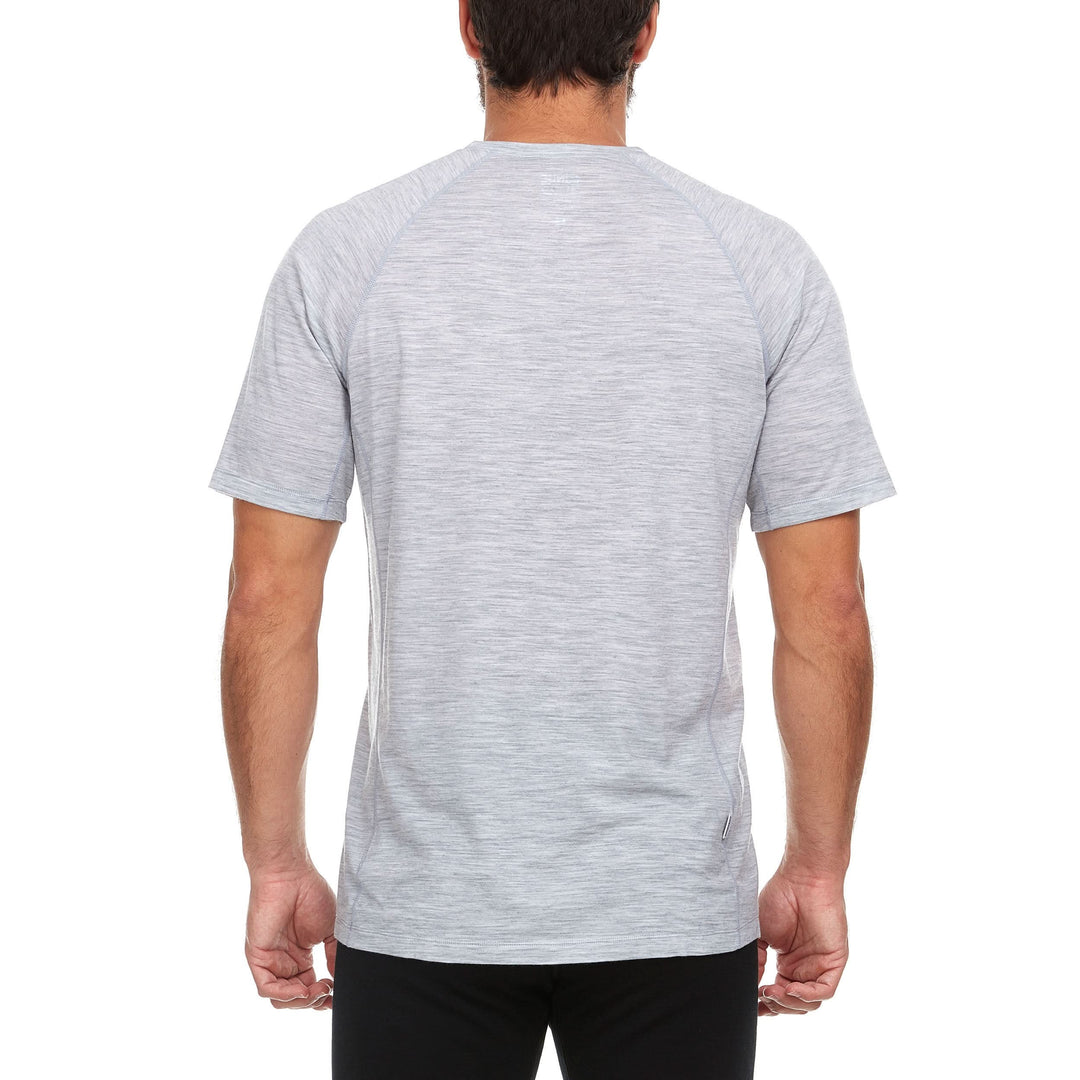 Side view of a man wearing an ash gray Woolverino micro weight merino wool short-sleeve V-neck T-shirt, showing the V neckline edge, shoulder seam, fitted sleeve, straight torso, and hip-length hem 