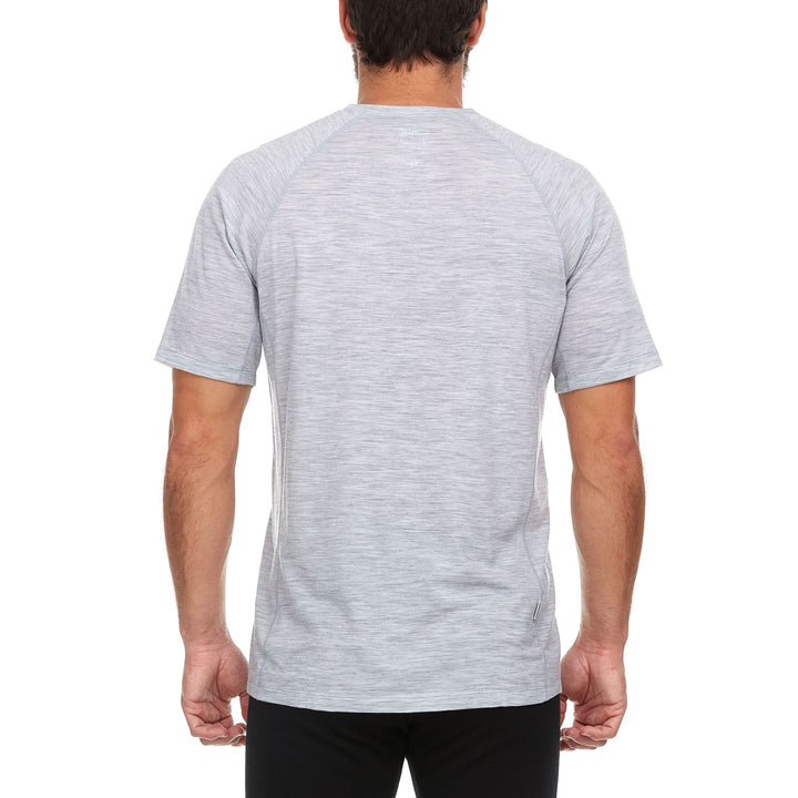 Side view of a man wearing an ash gray Woolverino micro weight merino wool short-sleeve V-neck T-shirt, showing the V neckline edge, shoulder seam, fitted sleeve, straight torso, and hip-length hem 