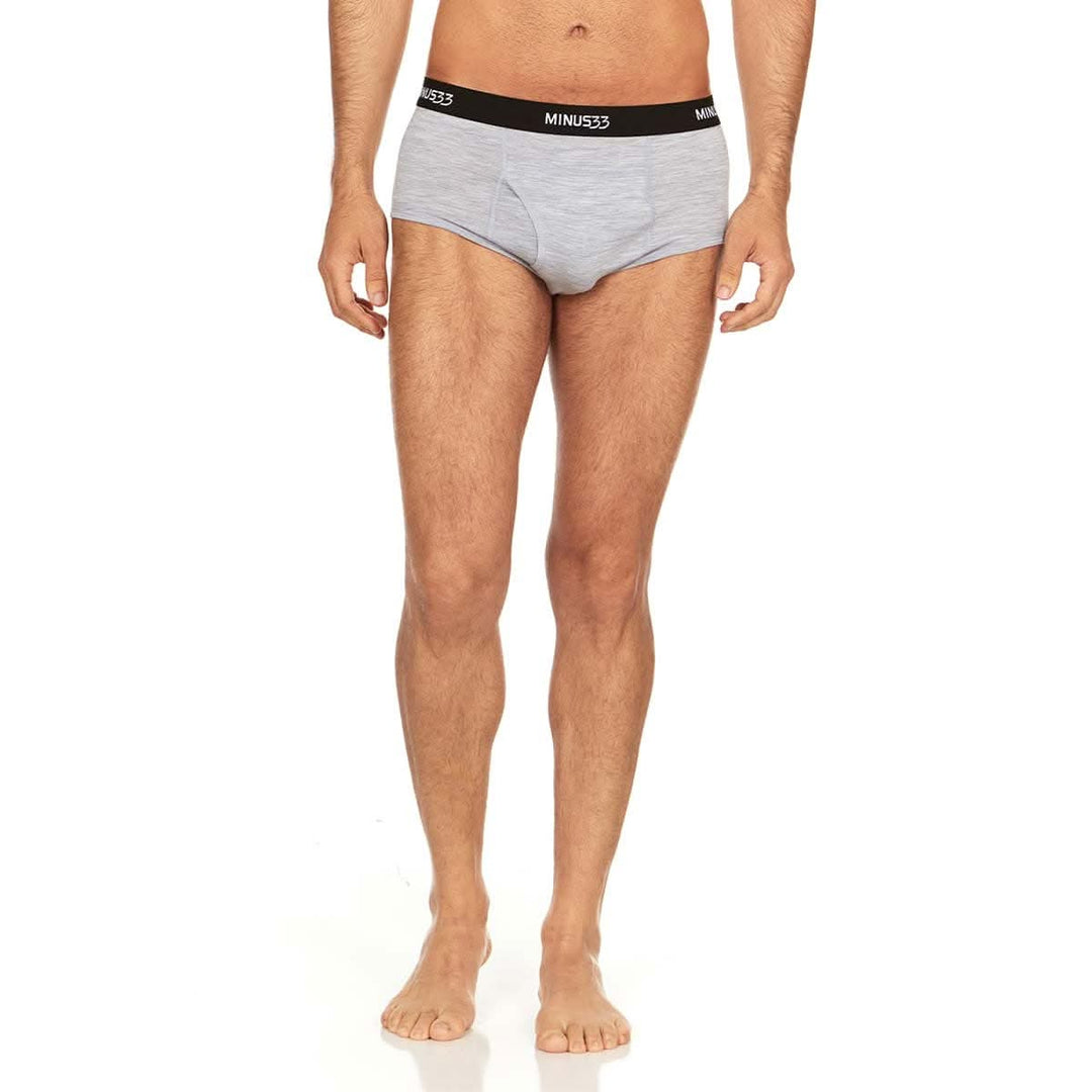 Front view from waist to upper thighs of a man wearing ash gray Woolverino micro weight merino wool briefs, showing the elastic waistband, contoured front pouch, high-cut leg openings, and close fit 