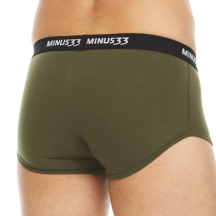 Front view from waist to upper thighs of a man wearing olive drab green Woolverino micro weight merino wool briefs, showing the elastic waistband, contoured front pouch, high-cut leg openings, and close fit 