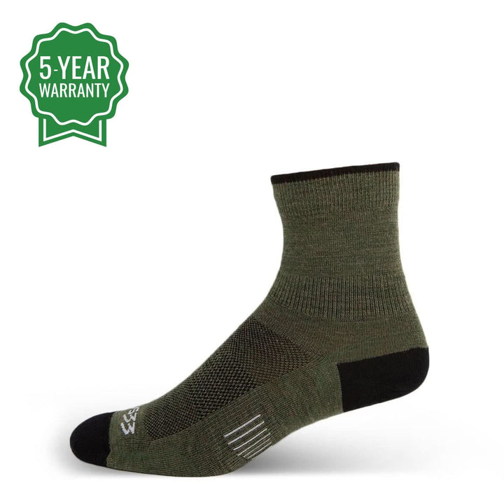 Side view of olive drab micro weight merino wool mini crew liner hiking socks arranged on a white background, showing short ribbed shafts, shaped heels, lightweight footbeds, and reinforced toes 