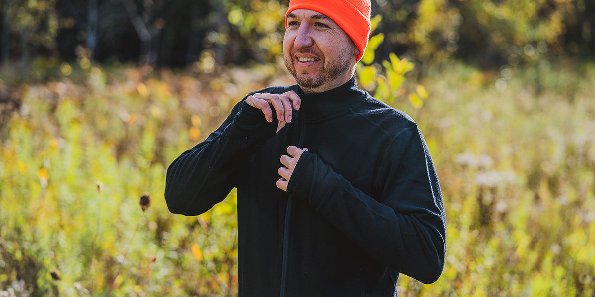 man wearing minus33 wilderness expedition full zip while hunting