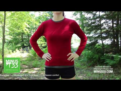 A video of a woman modeling a soft, 100% merino wool, midweight base layer crew top. The women&